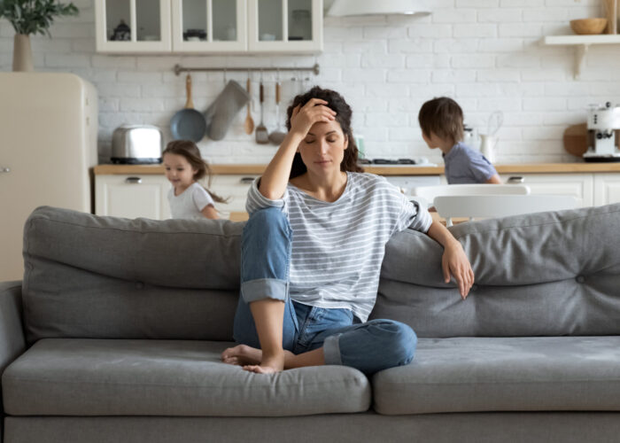 Young,Tired,Single,Mother,Suffers,From,Headache,Closed,Eyes,Touch